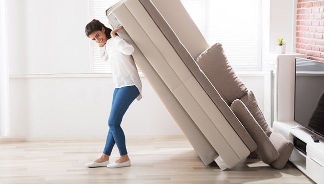 Lady moving sofa | Carpets To Go